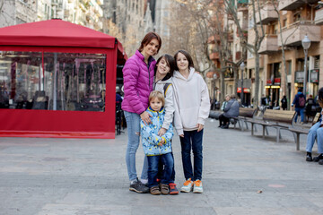 Cute little children tourists admiring Barcelona city, family travel with kids in Spain. Family...