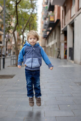 Cute little children tourists admiring Barcelona city, family travel with kids