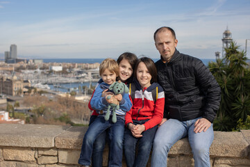 Cute little children tourists admiring Barcelona city, family travel with kids