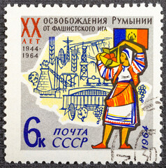 USSR - CIRCA 1964: A stamp printed in USSR shows Flag, Map, Woman with inscription Romanian People's Republic 20 years , circa 1964