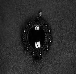 black magic amulet on a black background