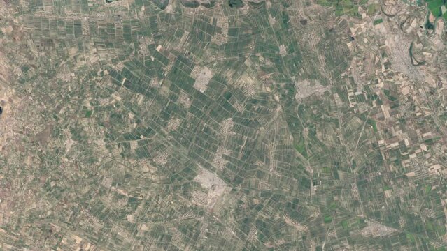 Cotton plantation drying farmed land time lapse aerial satellite view from space of Uzbekistan landscape. Based on image furnished by Nasa