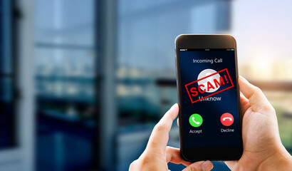 Phone Scam,fraud or phishing concept.Unknow caller show on mobile phone screen