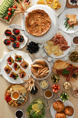 Dishes with different food on table, flat lay. Luxury brunch