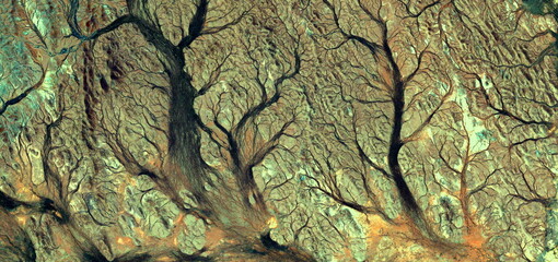 abstract landscape of the deserts of Africa from the air emulating the shapes and colors of the...