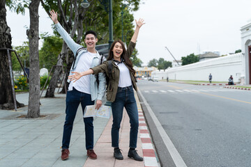 Asian attractive romantic couple travel in the city for honeymoon trip. 