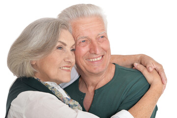 Happy senior couple posing on white background