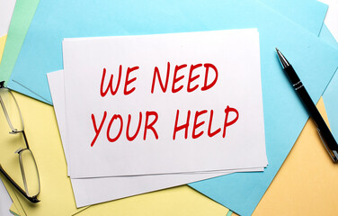 NEED YOUR HELP text on paper on the colorful paper background