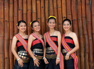 Portraits of Kadazan Dusun young girls in traditional attire from Kota Belud district during state level Harvest Festival in KDCA, Kota Kinabalu, Sabah Malaysia  - obrazy, fototapety, plakaty