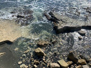 Rocky coastline, rocks and stones at the sea