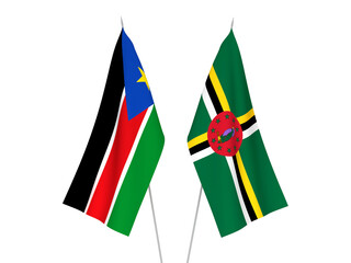 National fabric flags of Republic of South Sudan and Dominica isolated on white background. 3d rendering illustration.