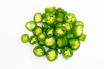 green chili pepper slices isolated on white background top view