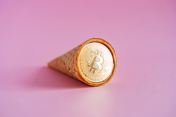 Bitcoin coin in a waffle horn. An unusual stylized photo of cryptocurrency. New ways to make money. Investing in cryptocurrency