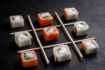 traditional japanese sushi dish, rolls. Sushi on a dark background