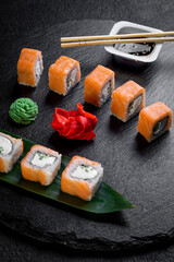 traditional japanese sushi dish, rolls. Sushi on a dark background