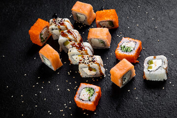 traditional japanese sushi dish, rolls. Sushi on a dark background