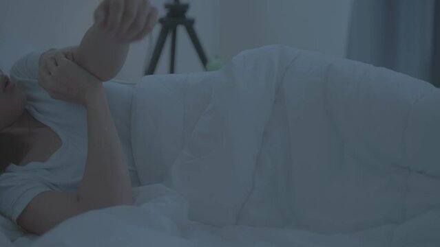 Asian young woman scratch hand feel suffer from allergy while sleeping