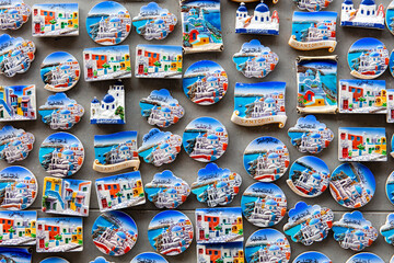 Santorini tourist souvenir fridge magnets on display in a shop in Santorini, Greece.
