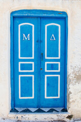 Blue and white front door in Santorini, Greece