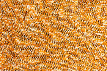 background of white and brown knitted fabric with zigzag pattern