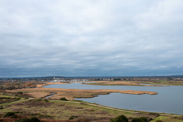 view from Hengistbury Head Dorset England with Christchurch Priory in the background