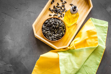 Sunflower oil in bottle with seeds. Cooking oil background