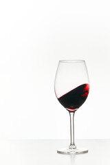 Glass of red wine isolated on white