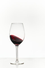 Glass of red wine isolated on white