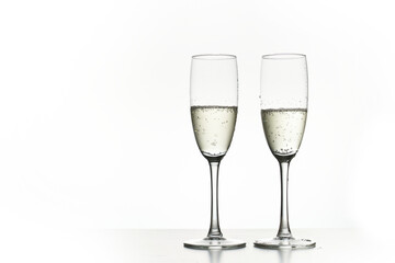 Two glasses of champagne. Isolated on white