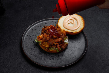 burger with minced smoked meat on a dark background