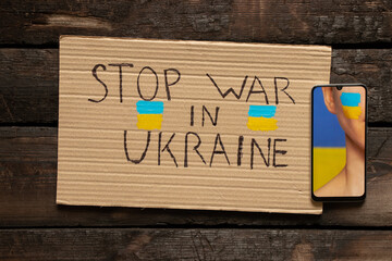 The face of a girl with the national flag of Ukraine yellow-blue on her face as a background on the...