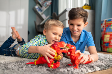 Kids acting out stories with toy dinosaurs
