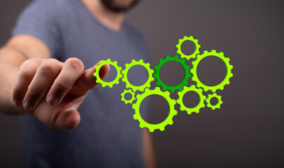 Set of green gears and cogs on black background