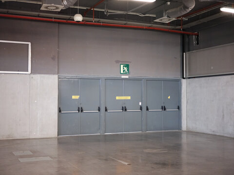 Emergency exit doors of a car parking space