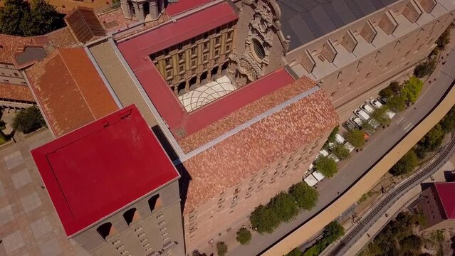 Drone shot of Mount Montserrat. Drone view of the famous monastery. Mountain shelter of Benedictine monks. The jagged mountains of Spain. Mountain trails. Barcelona Summer. High quality 4k footage