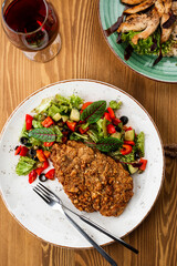grilled pork with a side dish. restaurant menu