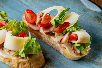 baguette sandwich, on a beautiful plate on a wooden background