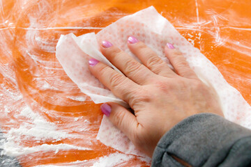 close up hand cleaning table