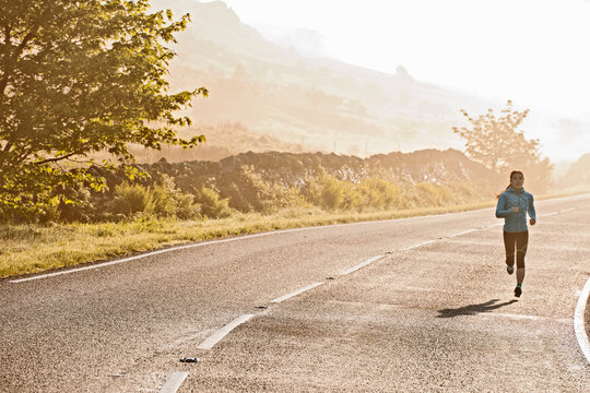 Woman out for an early morning run at Snowdonia National Park