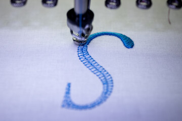 Machine embroidery of the letter 