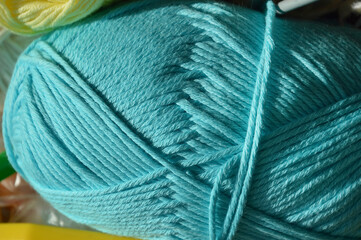 knitting day. colored motoki woolen thread needlework. background for the design.