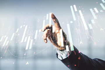 Double exposure of man hand working with virtual creative financial diagram on blurred office background, banking and accounting concept