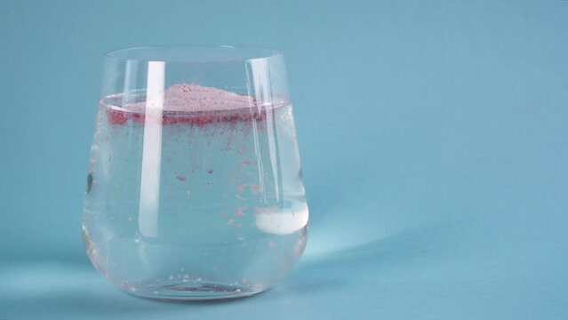 Adding collagen powder in a glass of water. Superfood additives. Skin care.
