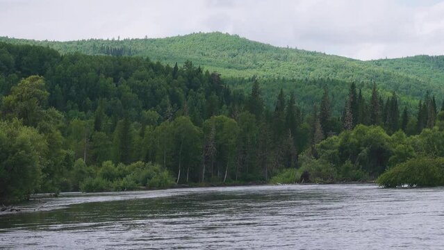 Middle Siberia, Krasnoyarsk Territory. Hilly (coniform hill) river bank, pour. Taiga mixed forests
