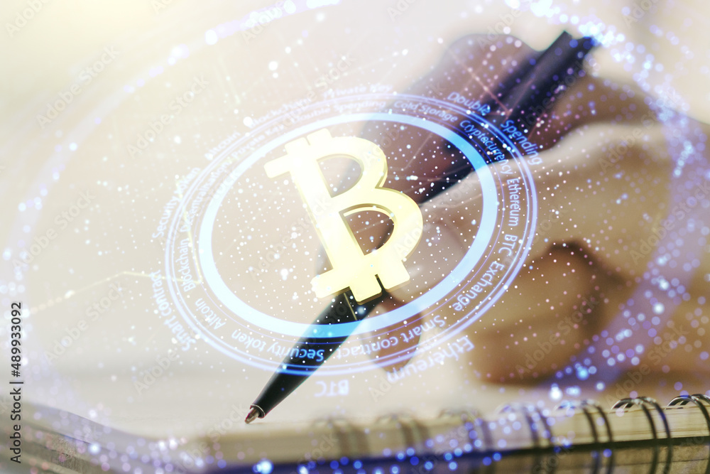 Aufkleber double exposure of creative bitcoin symbol hologram with woman hand writing in notepad on background