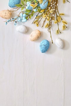 Willow branches and decorations, easter eggs on a light background. Happy easter flat lay concept