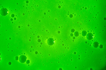Bubble green background texture. Berry gel to cleanse the skin of the face and body. Spa treatments, skin care. Bath foam, detergent. Slime lime