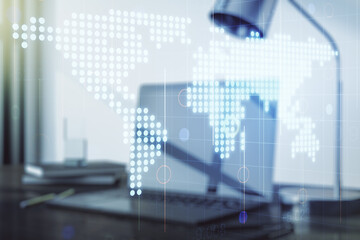 Double exposure of abstract digital world map on laptop background, research and strategy concept