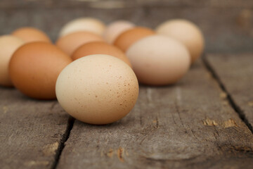 close up of brown eggs on old rural table