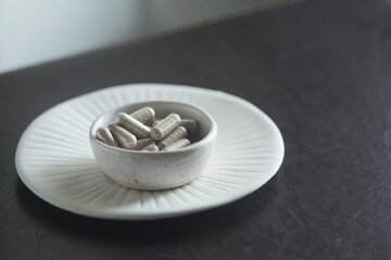 pills on white plate of medicines, capsules